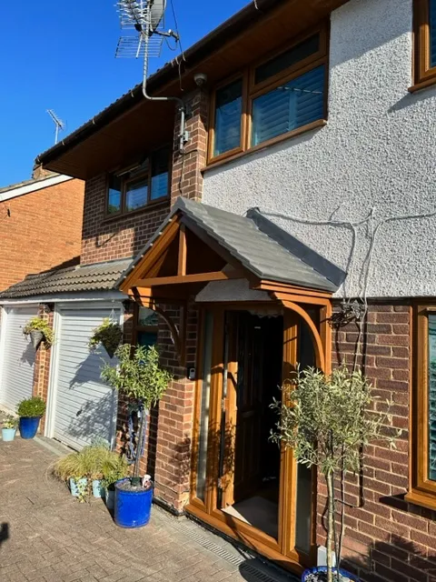a house with a weather vane on the roof