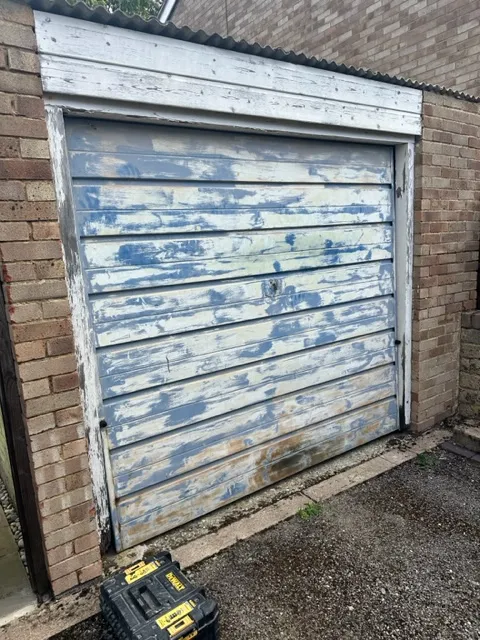 a garage door with a tool box in front of it